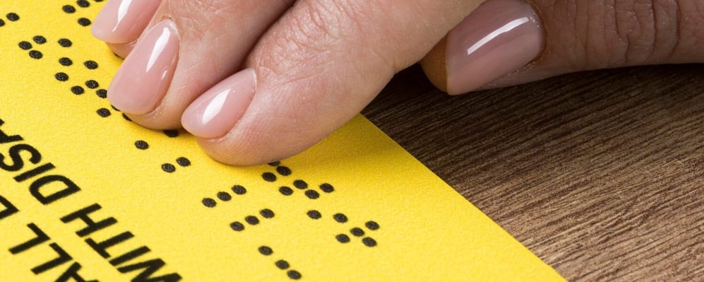 hand-touching-braille-words-1